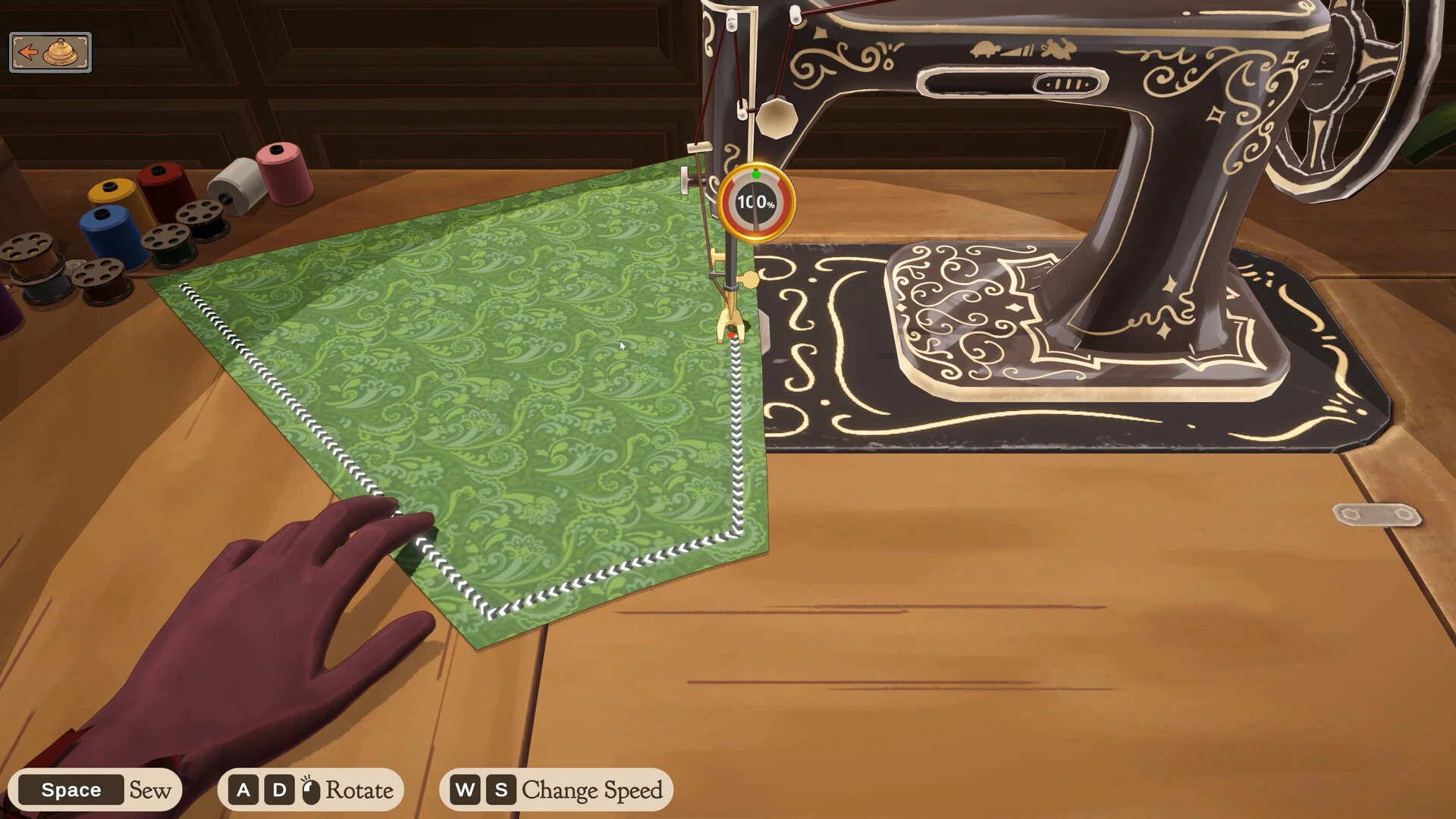 Green patterned fabric being fed through a vintage sewing machine in Dressmaker, with on-screen keys for sew, rotate and change speed