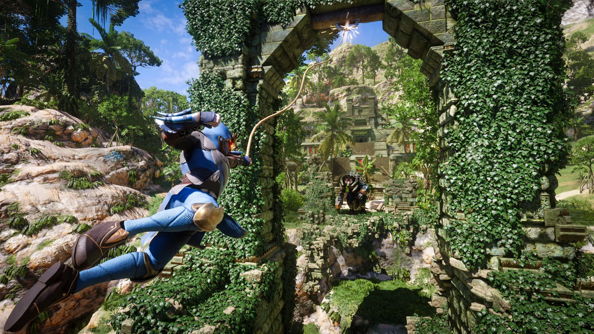 A player swings on a grappling hook past an ivy-covered stone arch in a jungle ruin