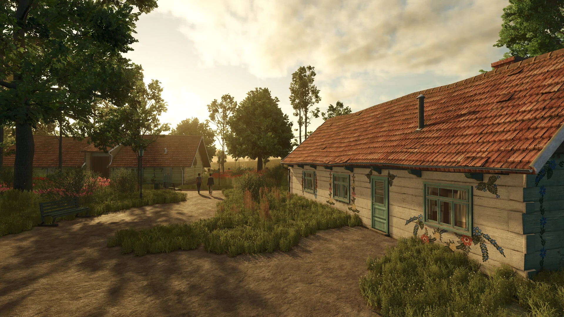 A long farmhouse with a red tile roof and a cottage garden at sunset in Farming Simulator 25