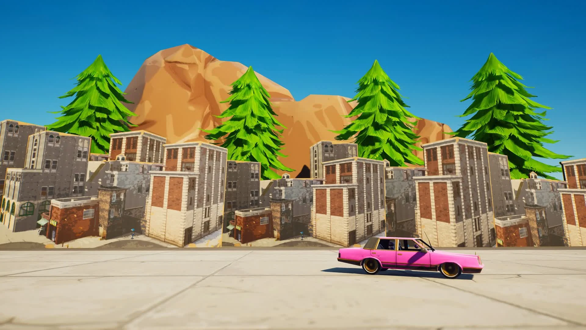A pink car drives past the brick buildings of Tilted Towers under pine trees and a rocky hill in the Tilted Zone Wars island
