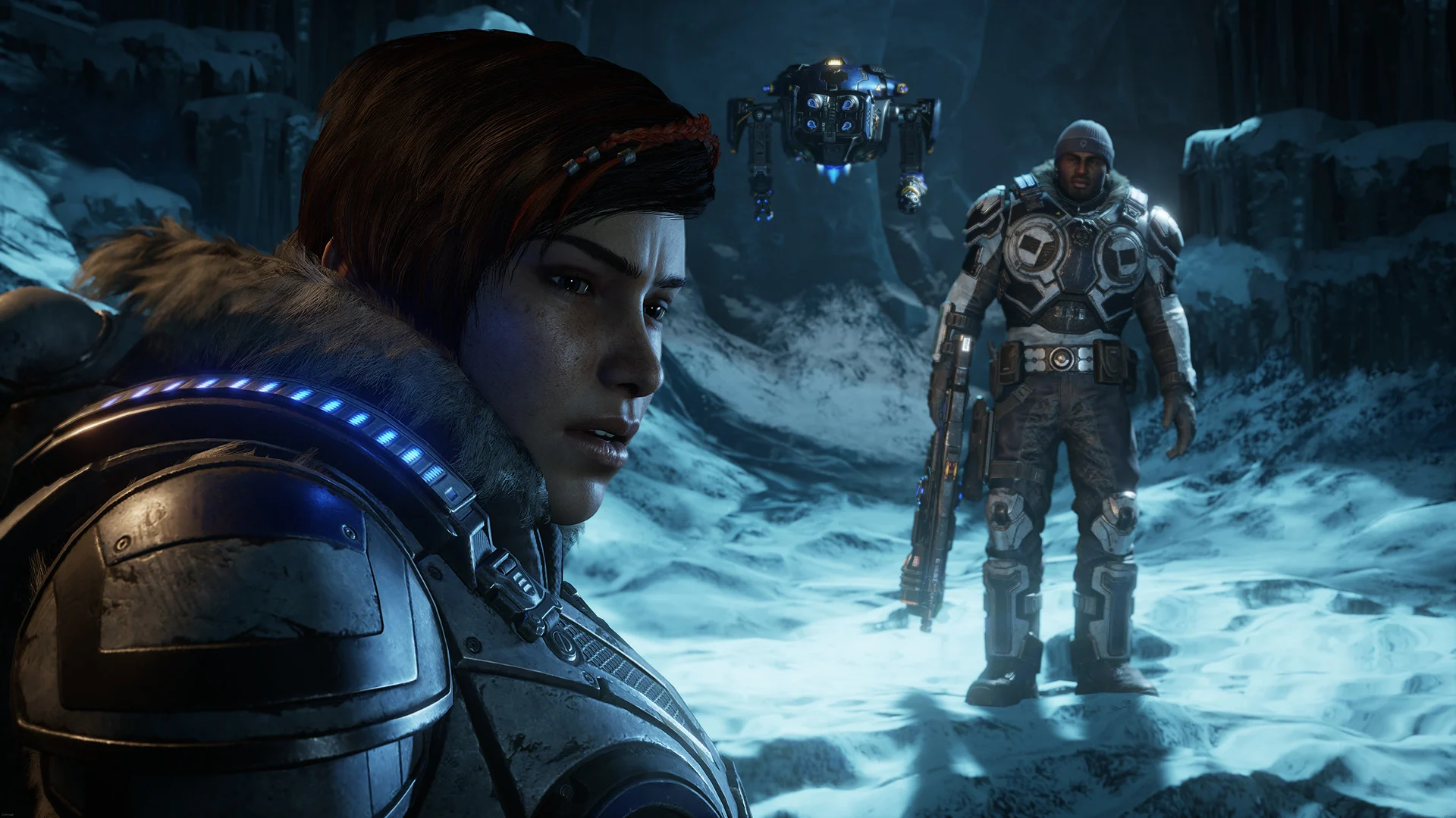 Kait Diaz and Del Walker cross a frozen landscape at night with the Jack robot hovering behind them