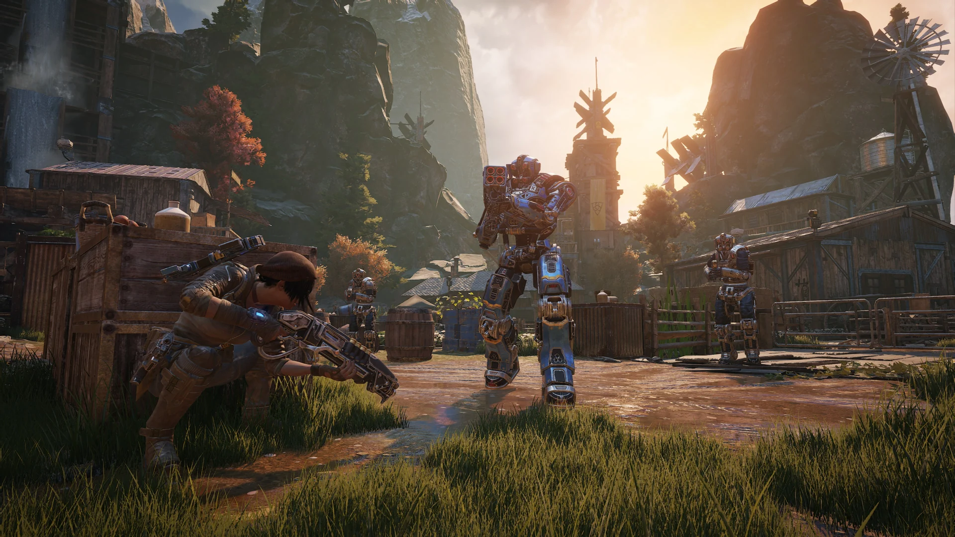 A soldier crouches in the grass and fires at robots in a mountain village
