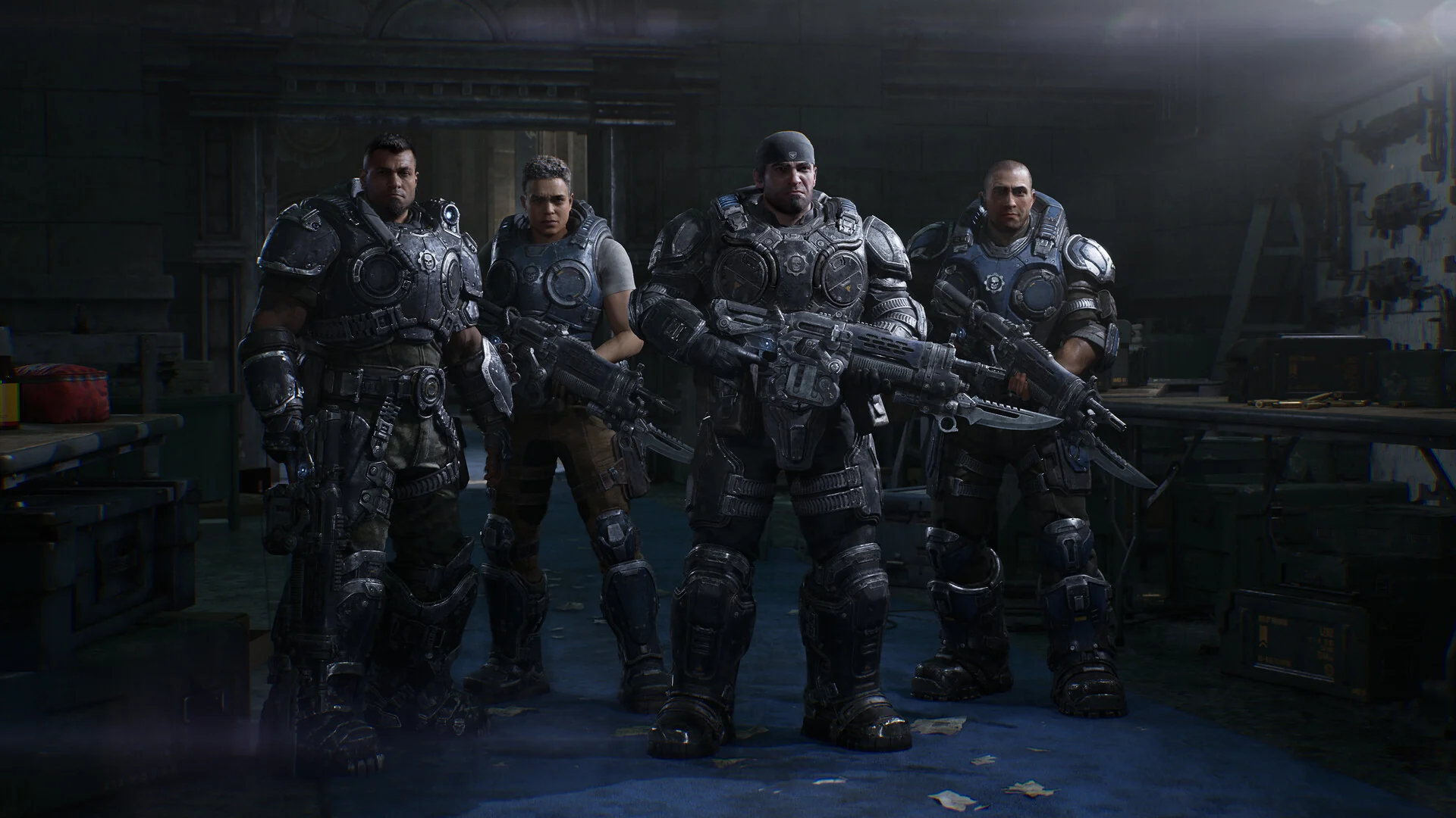 Marcus Fenix, Dom Santiago and two new squadmates stand together in full COG armor holding Lancer rifles in a dim armory