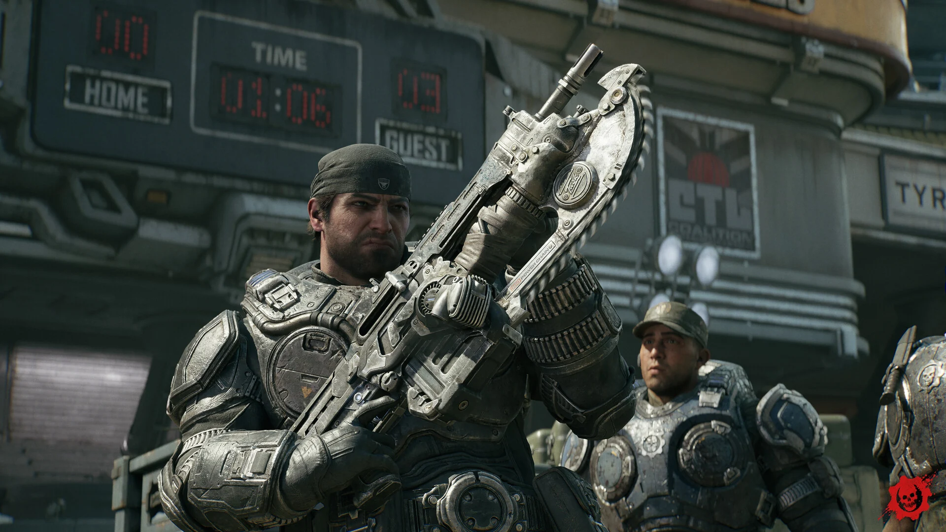 Marcus Fenix holds up a Lancer rifle with a chainsaw bayonet in front of a stadium scoreboard while another soldier watches