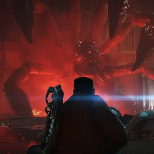 A soldier with a rifle on his back faces a giant many-legged creature bursting out of a street lit in red