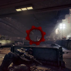 Third-person gameplay with a soldier in cover behind a barrier aiming at enemies under an elevated rail line, with the red damage indicator in the middle of the screen