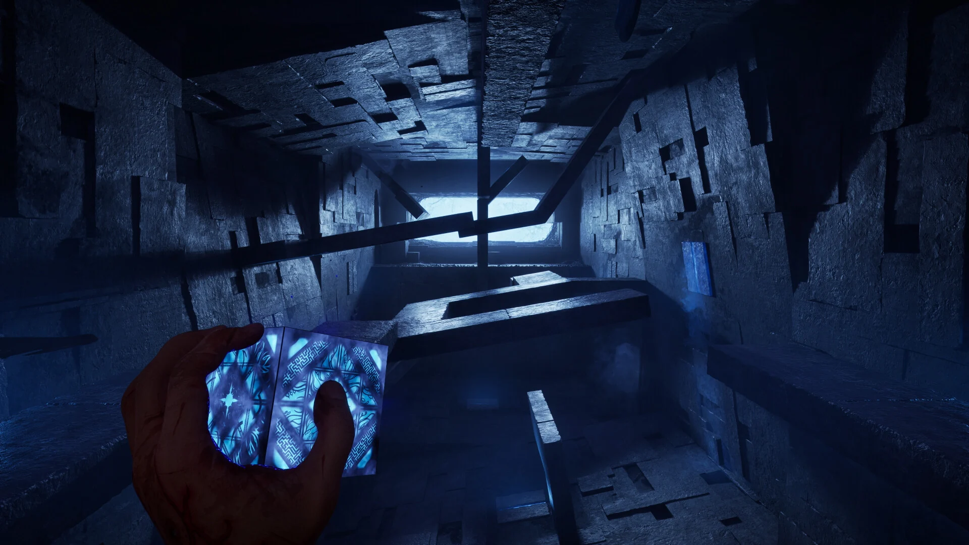 The player holds the glowing puzzle box in a shifting stone corridor of the Labyrinth, the Cenobites' maze-like home dimension