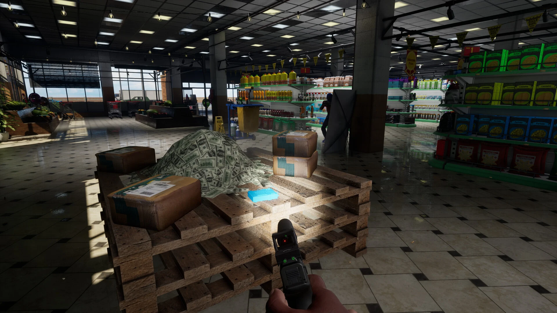 First-person view holding a pistol beside a pile of cash on wooden pallets inside a dim supermarket with stocked shelves