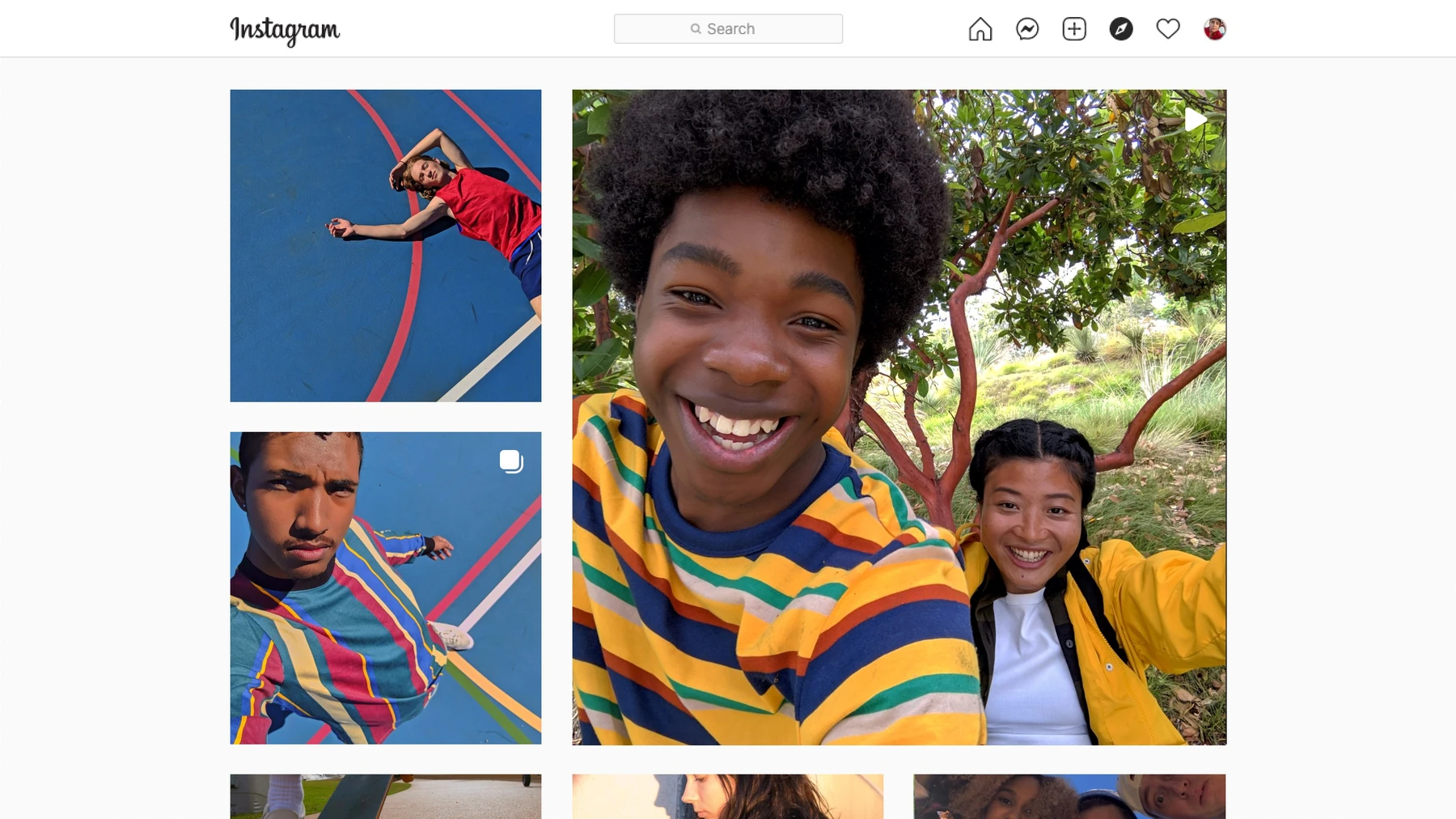 Instagram on a PC showing a grid of photos with one large selfie of two friends and smaller photos beside it