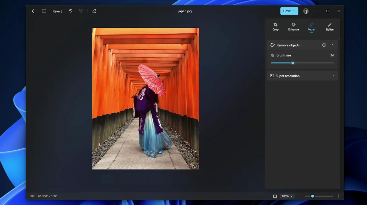 Microsoft Photos editor Repair tab with Remove objects and a brush size slider, next to a photo of a woman with a red umbrella in a shrine gate tunnel