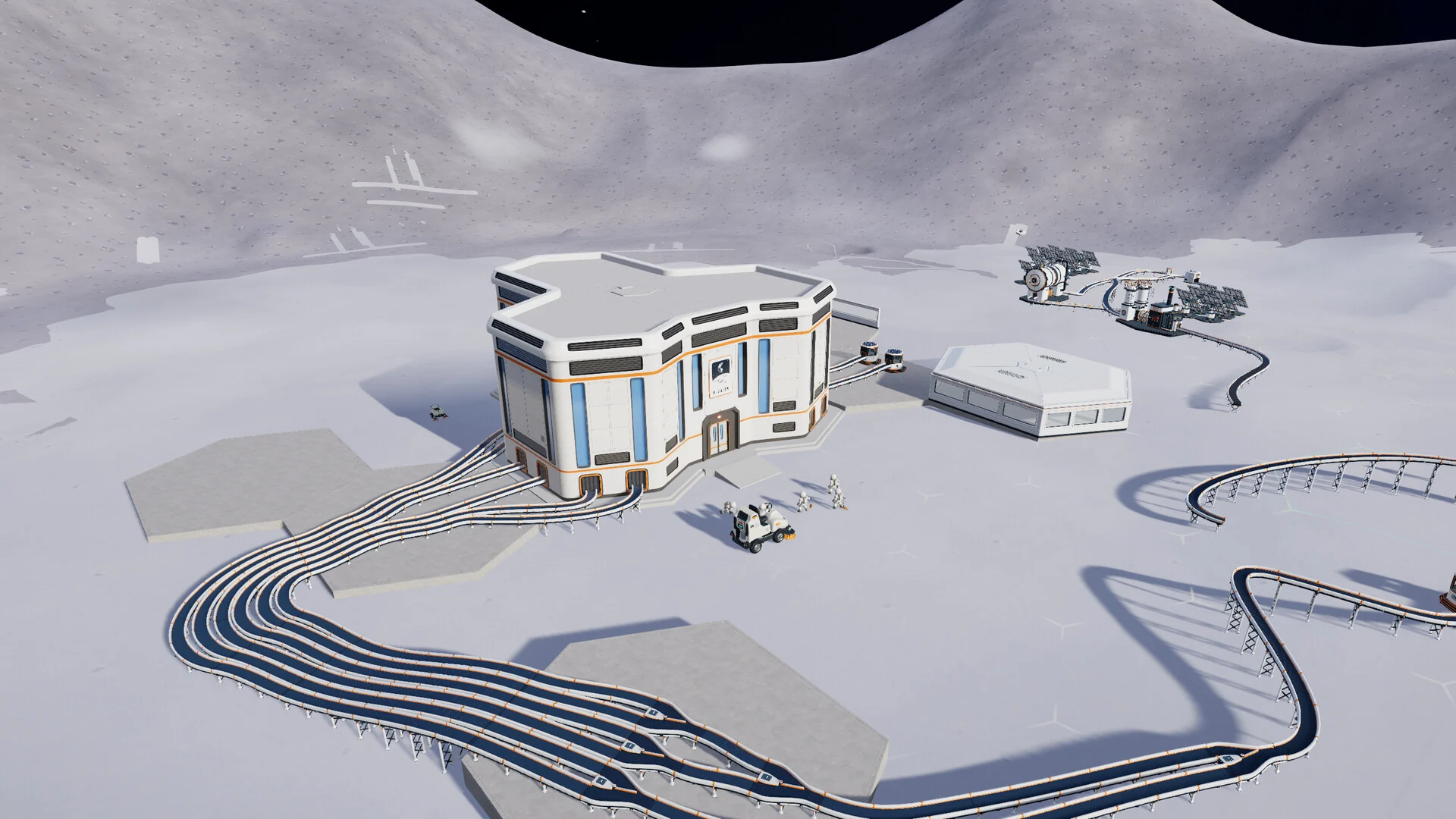 A wide view of a lunar base with a headquarters building, hexagonal foundations and long looping conveyor belts
