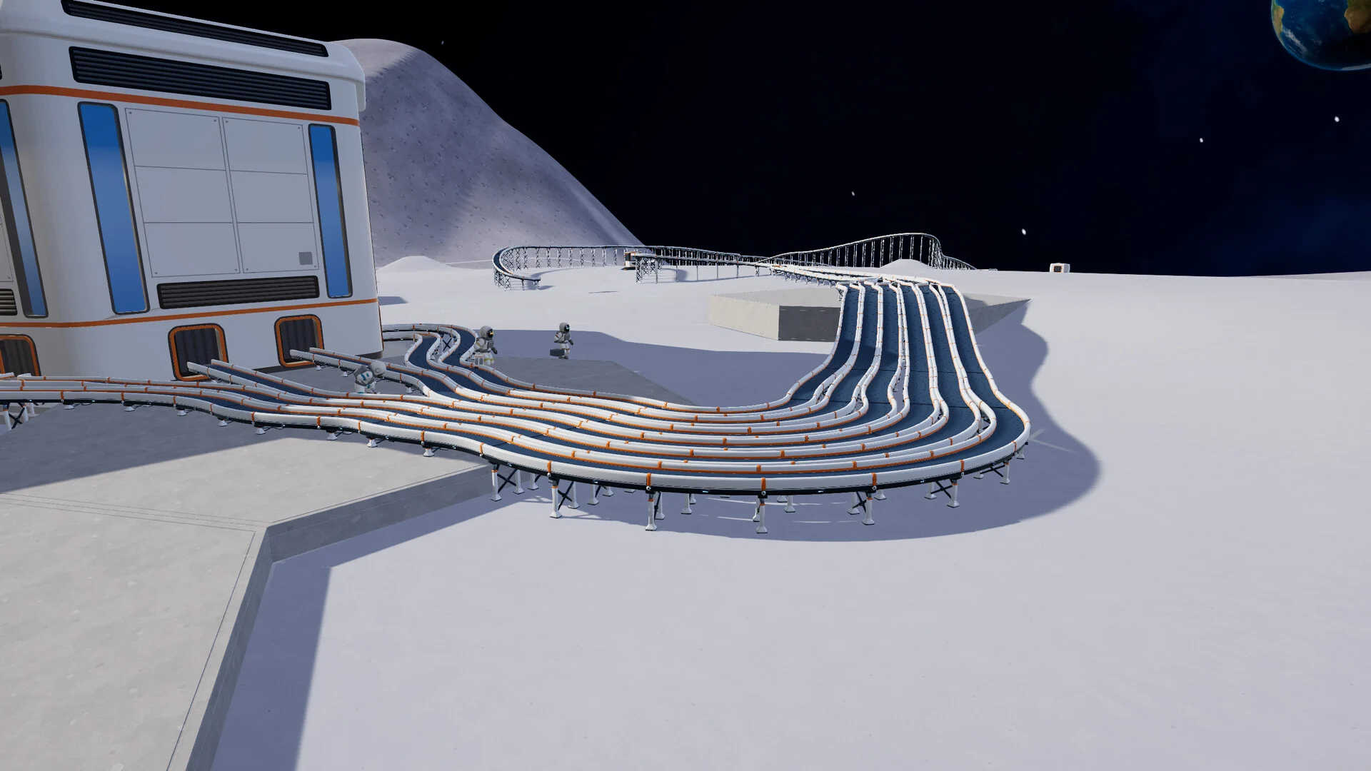 Bundles of conveyor belts curve across the lunar surface away from a white and orange base building