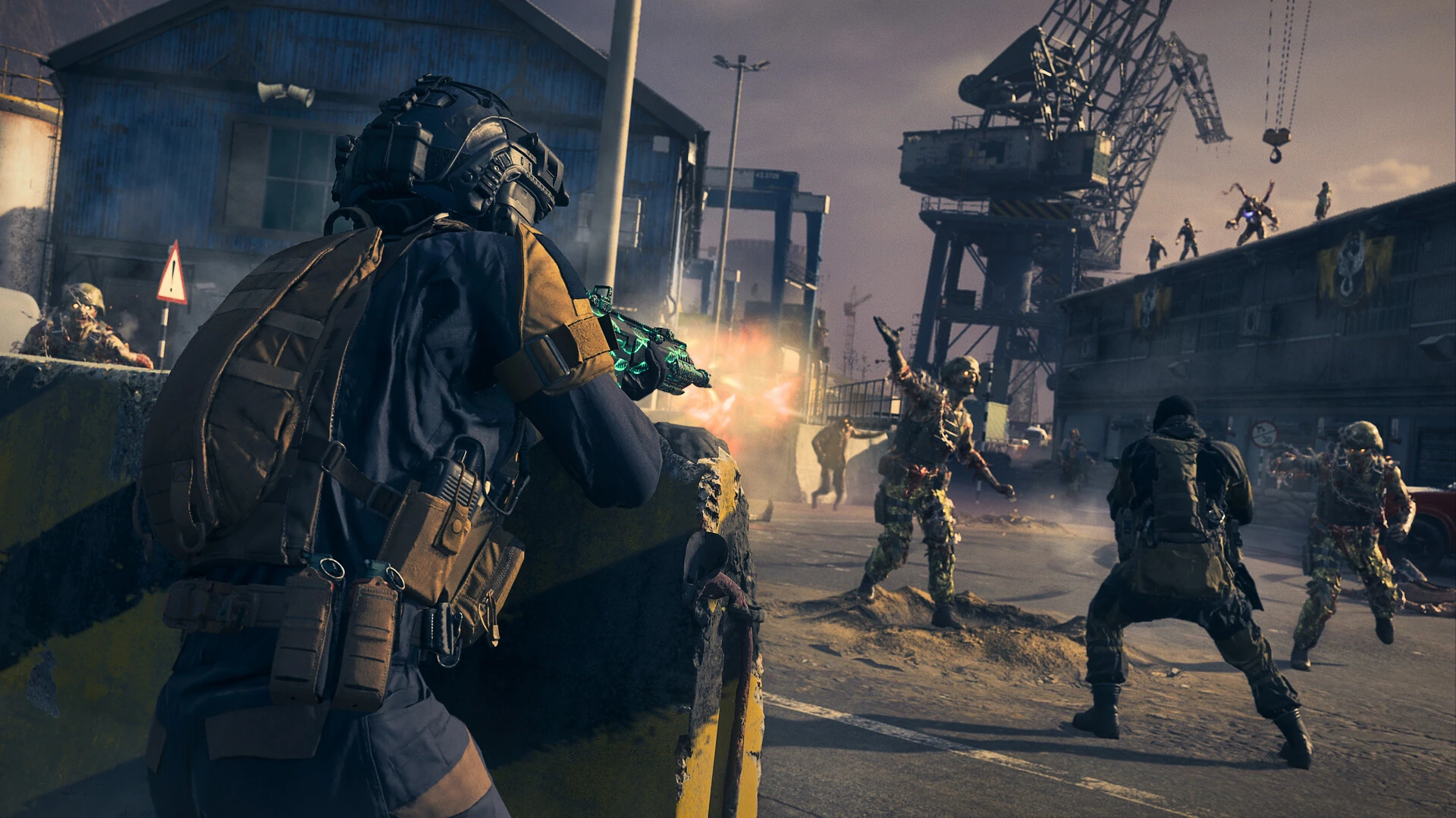 An operator fires from cover during a firefight in a dockyard lined with cranes