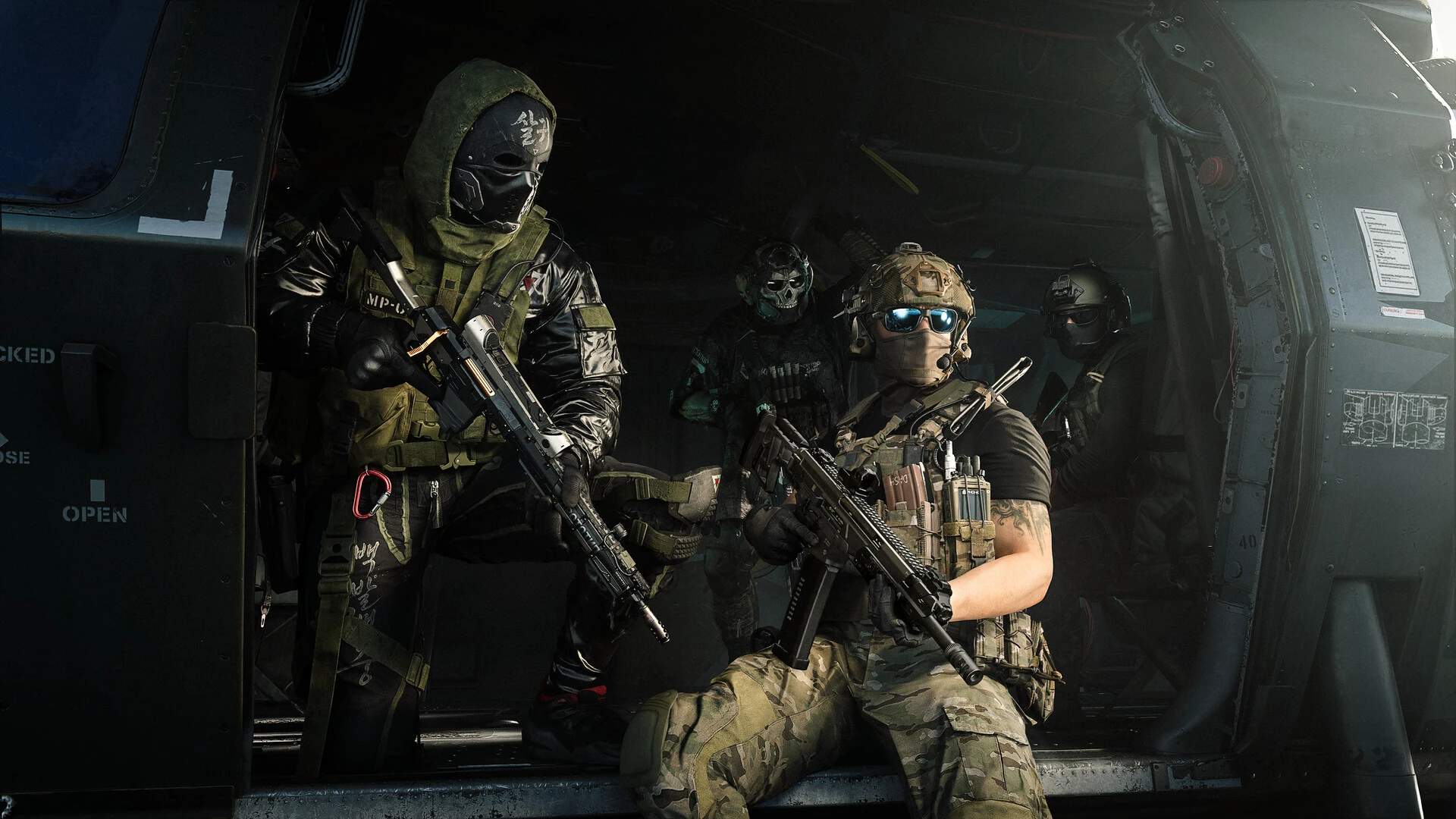 Four masked and armed operators sit together inside a helicopter cabin before a mission