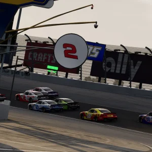 Cup cars run single file past the pit road position tower showing car numbers on a big oval
