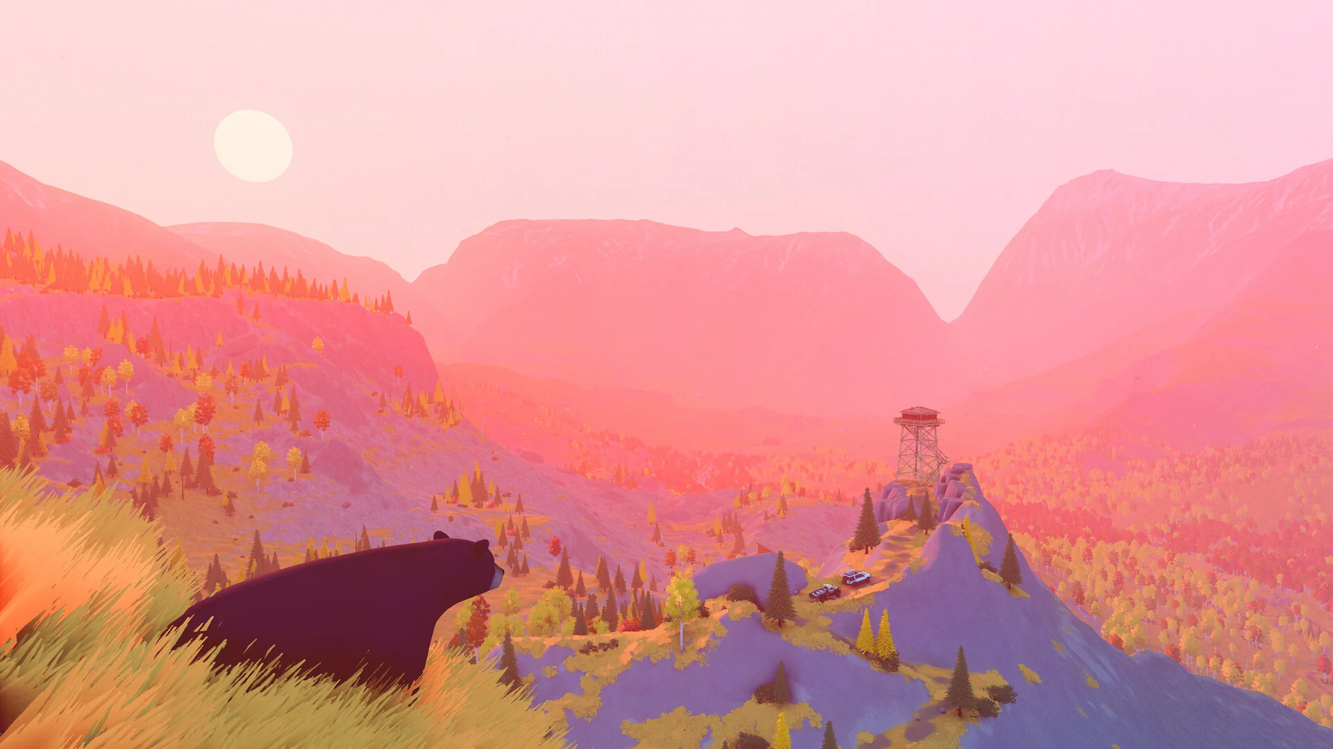 A bear stands on a ridge at sunset looking across a pink valley toward a wooden fire lookout tower
