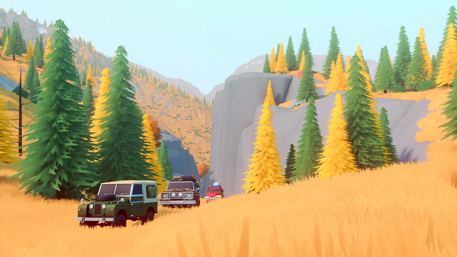 A green classic 4x4 leads a line of off-roaders through golden grass and pine forest below a cliff
