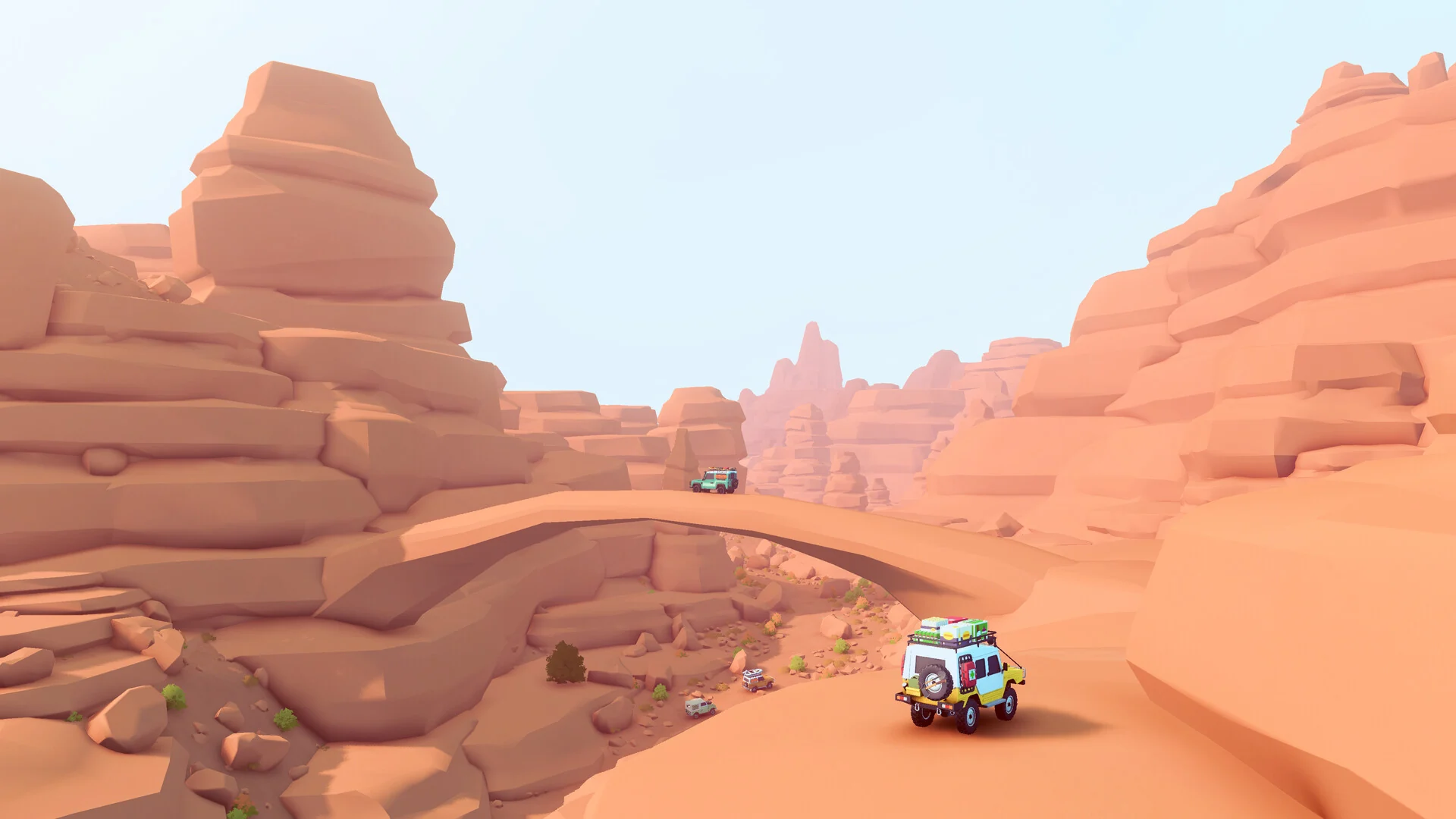 A small 4x4 drives toward a natural stone arch through orange sandstone rocks