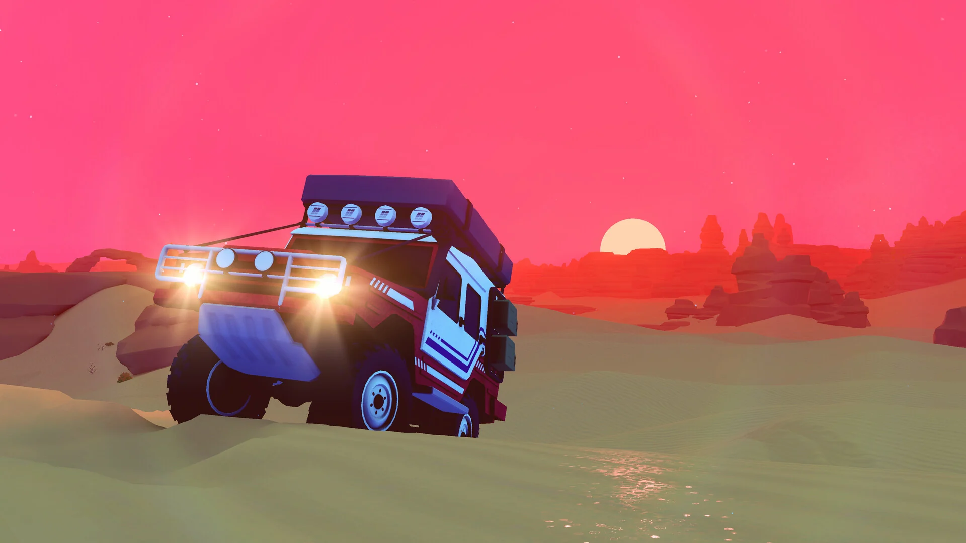 A blue 4x4 with roof lights on drives over a grassy hill under a deep red sunset