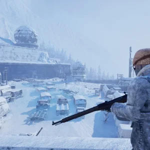 A survivor in a knit hat holds a bolt-action rifle on a snowy ridge above a frozen observatory and parking lot