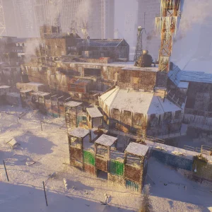 A fortified settlement built from shipping containers and scrap wood glows in low evening sun on a snowy hillside