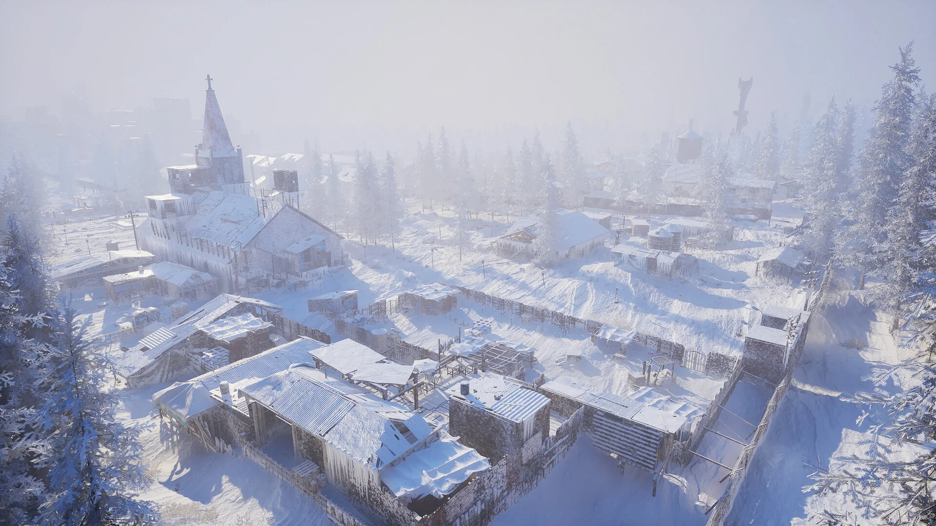 Aerial view of a snow-covered settlement with wooden houses and a church spire, surrounded by pine forest in thick fog