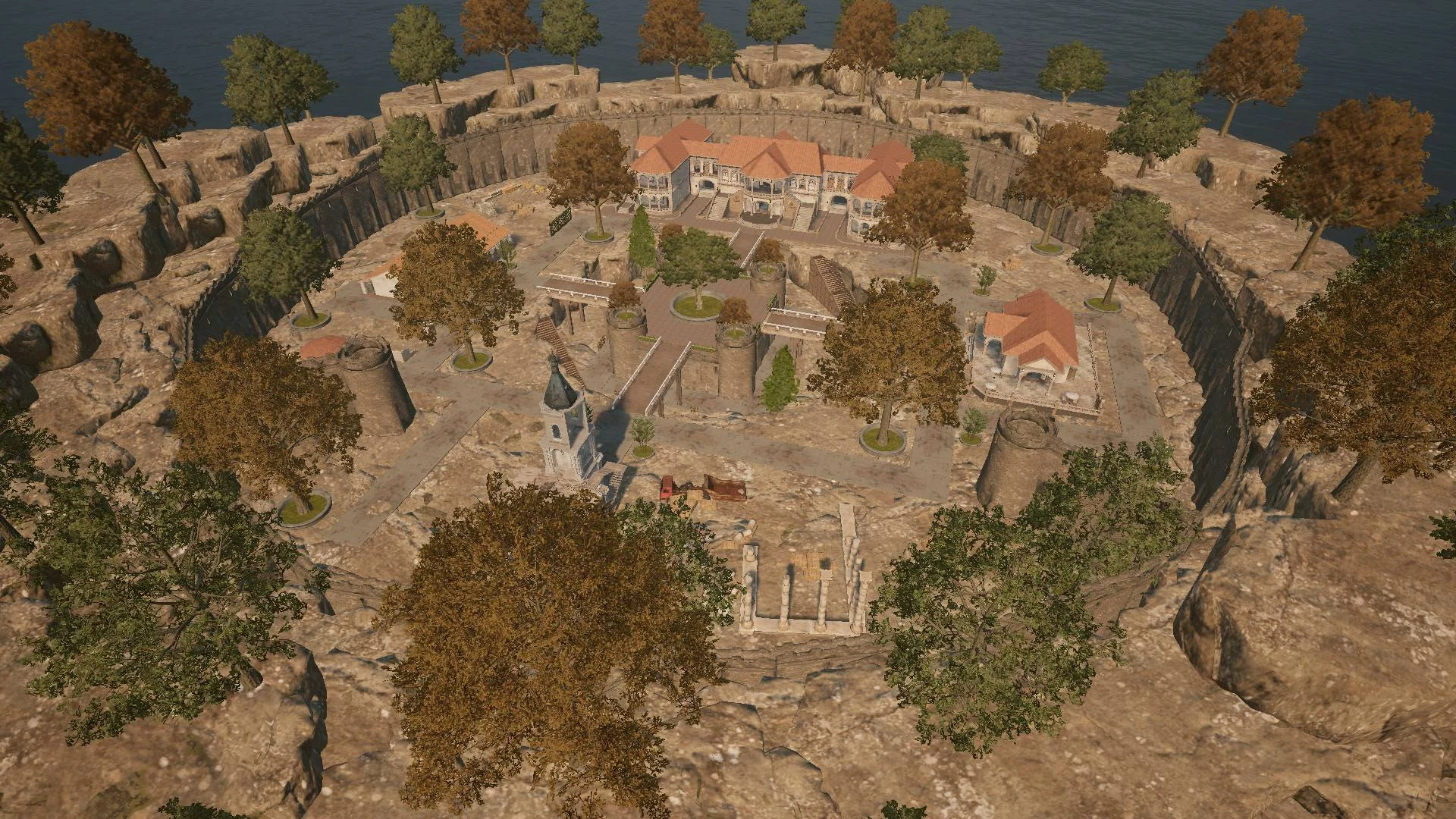 Overhead view of a walled arena with trees, rocks and old buildings built for a PUBG hide-and-seek custom mode