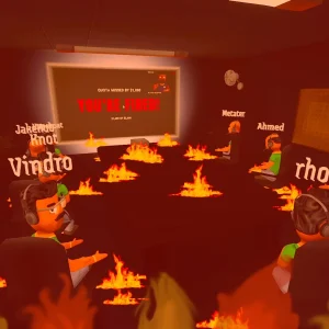 Players watch a big screen at the front of the office during the boss's performance review while flames fill the room
