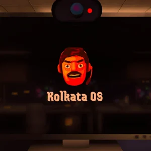 A desk monitor showing the Kolkata OS boot screen with the angry boss's face above the logo