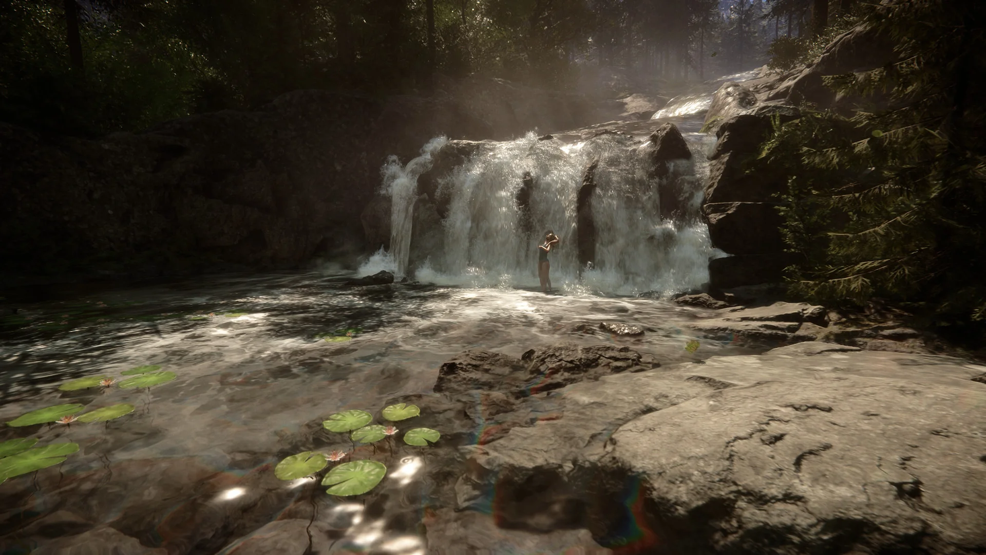 A cannibal stands at the foot of a waterfall above a rocky pool dotted with lily pads in a sunlit forest
