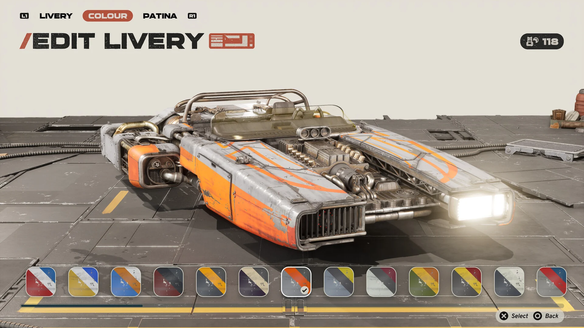 The Edit Livery screen showing an orange and silver landspeeder with a row of color swatches to choose from