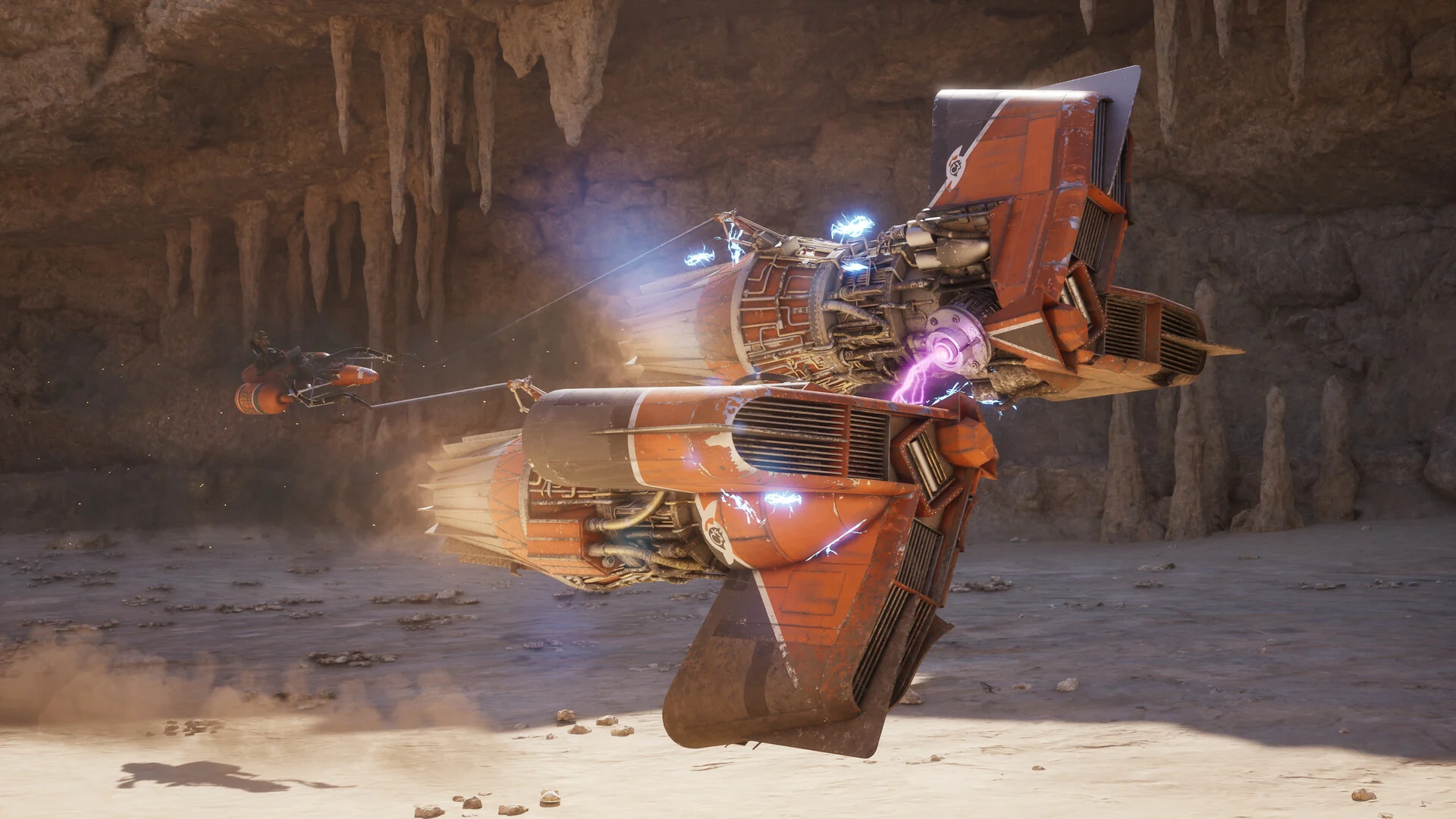 An orange podracer with glowing engines races through a cave lined with stalactites
