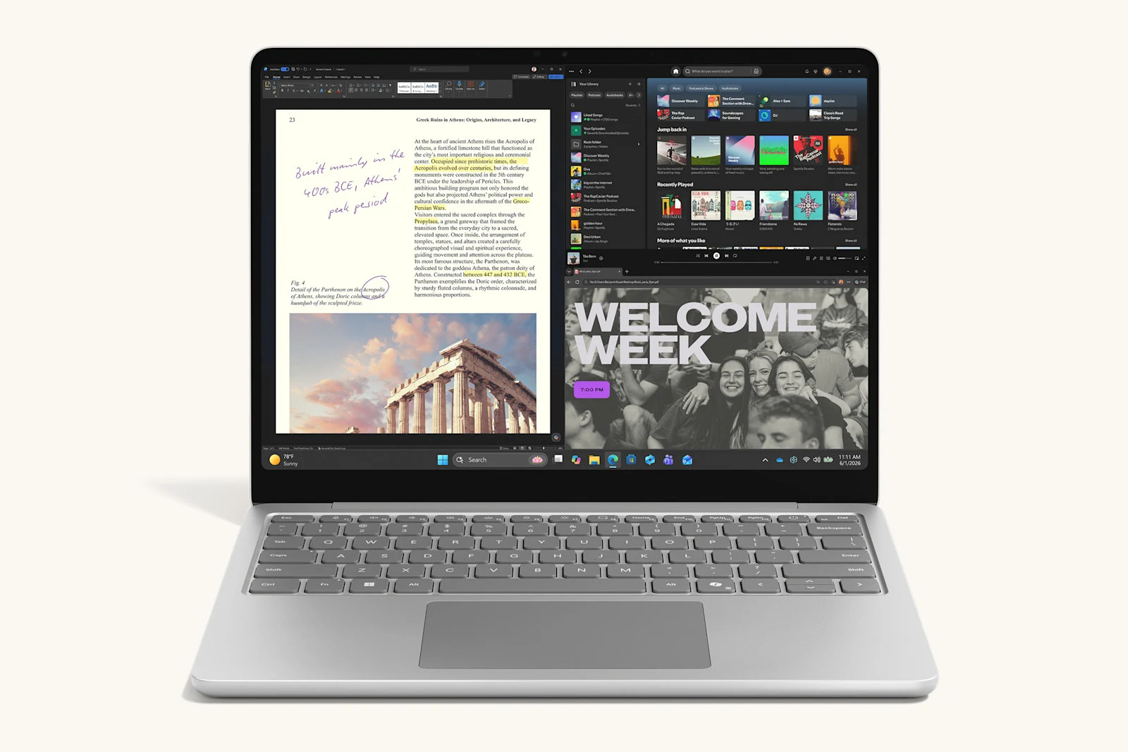Silver Surface Laptop 13-inch showing a handwritten note on a document beside a music app and a poster in split screen