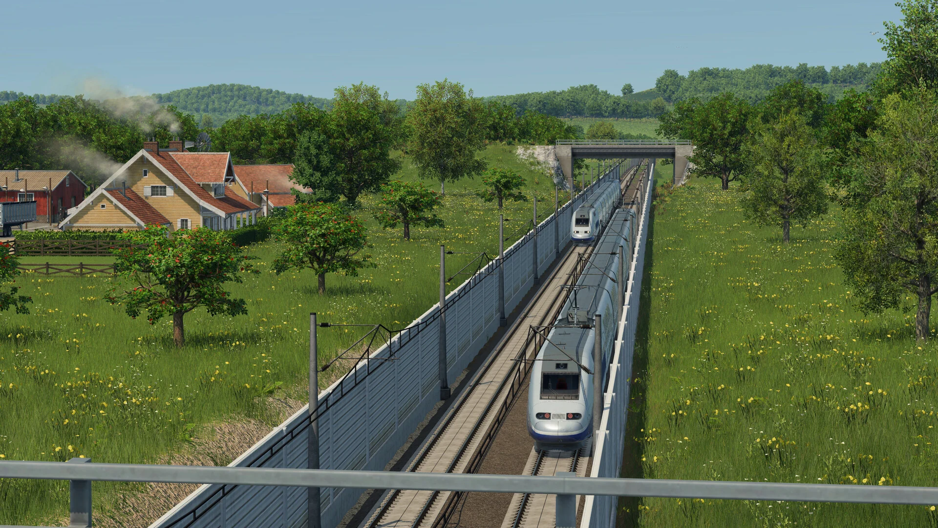A modern high-speed train speeding along a fenced double track through green countryside past a village in Transport Fever 3