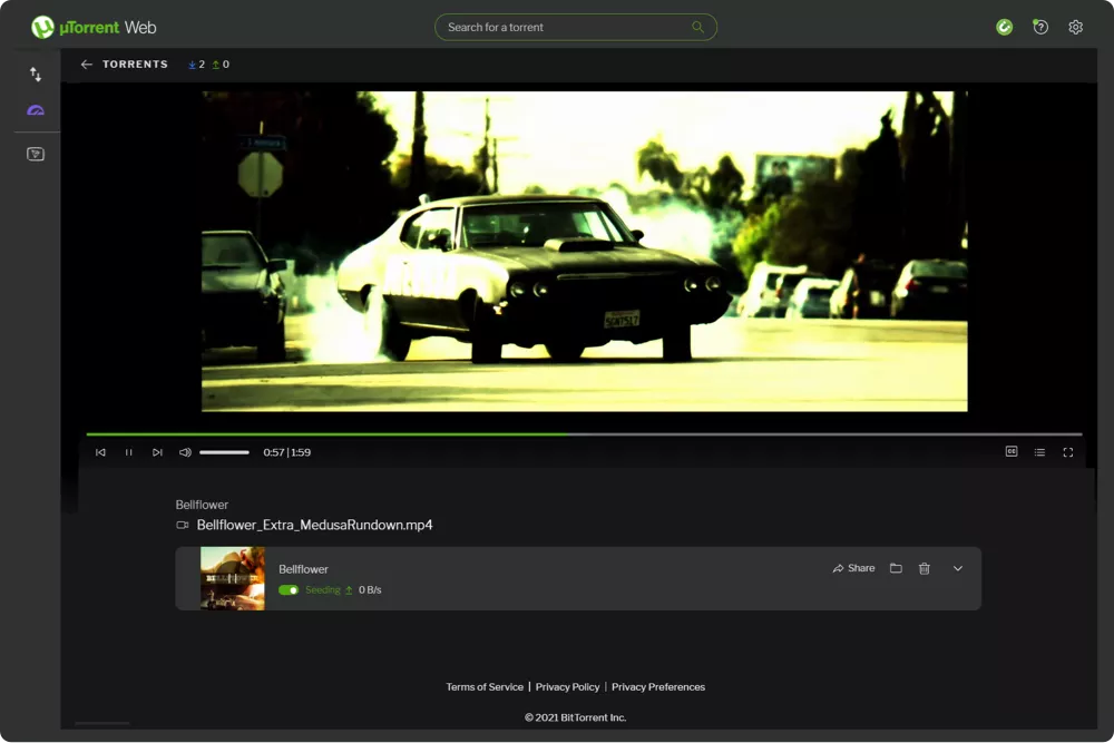 uTorrent Web open in a browser tab, playing a video in its built-in player while the torrent keeps seeding underneath