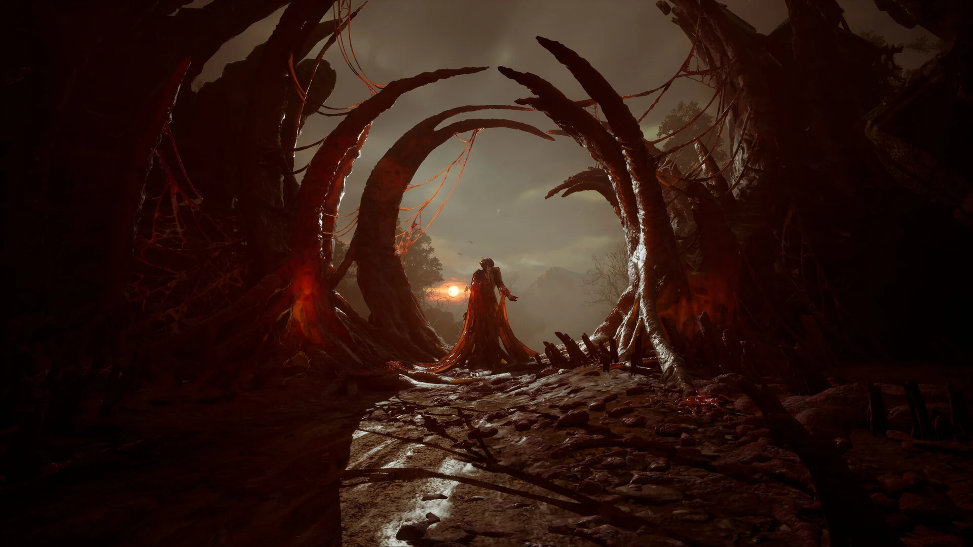 A cloaked figure stands before a gate made of twisted red roots in a dark cavern