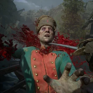 A saber runs through the neck of a soldier in a green and red Napoleonic uniform and fur hat, with blood spraying in a ruined village